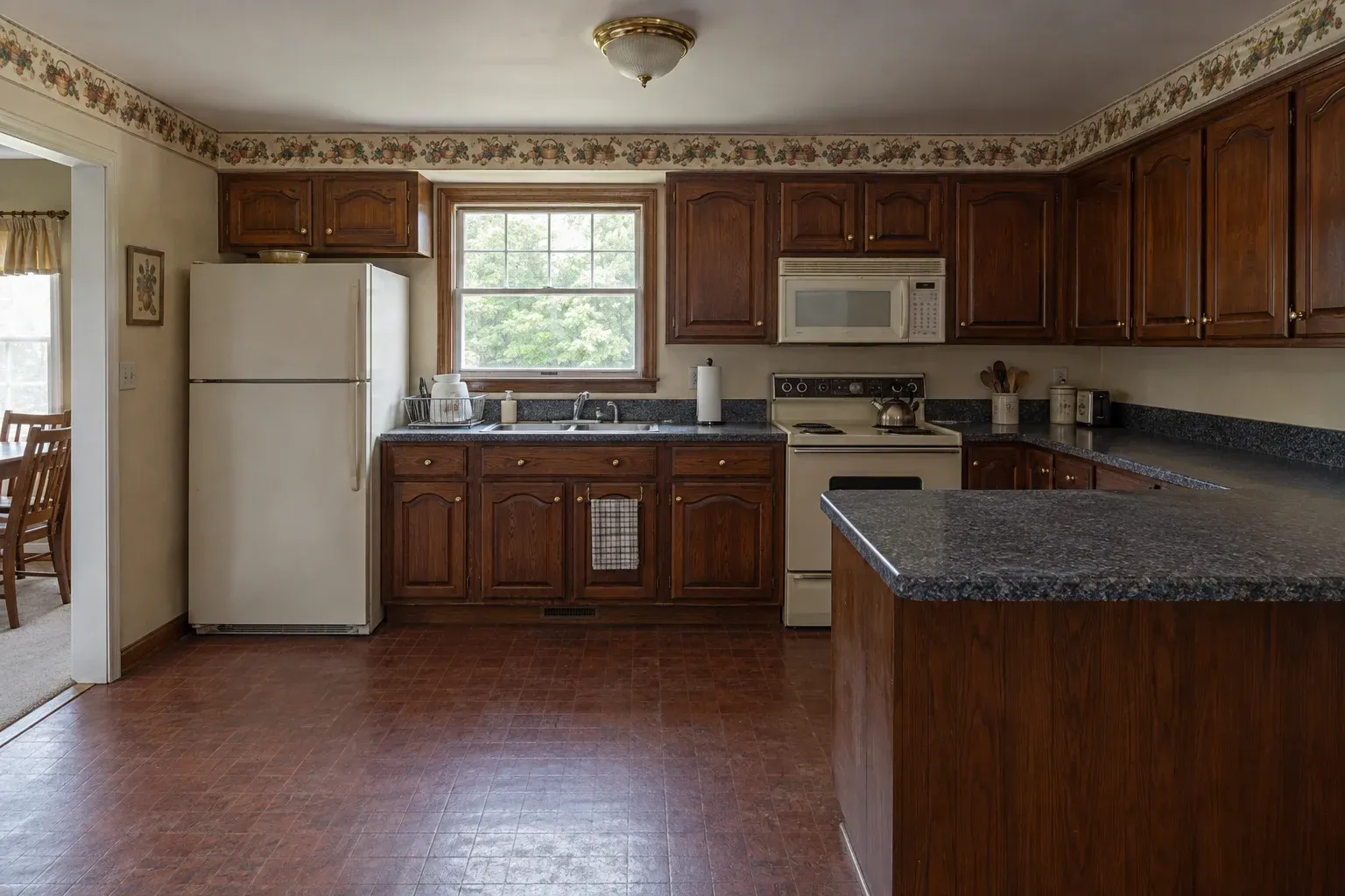 Cherry cabinetry before refacing